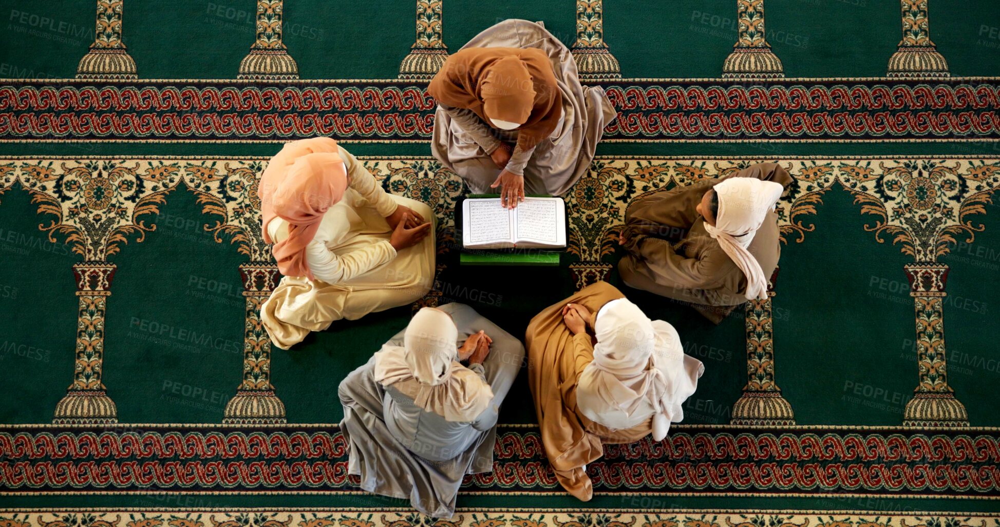 Buy stock photo Muslim, people or above of Quran to worship for support, teaching or learning gratitude to Allah. Palestine, prayer book and women kneeling for God on Ramadan for studying Islamic religion together