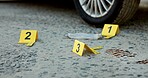 Crime scene, evidence and investigation with number label for forensic science on street. Police case, blood and footprint clues for DNA, detective and discovery for arrest of criminal outdoor