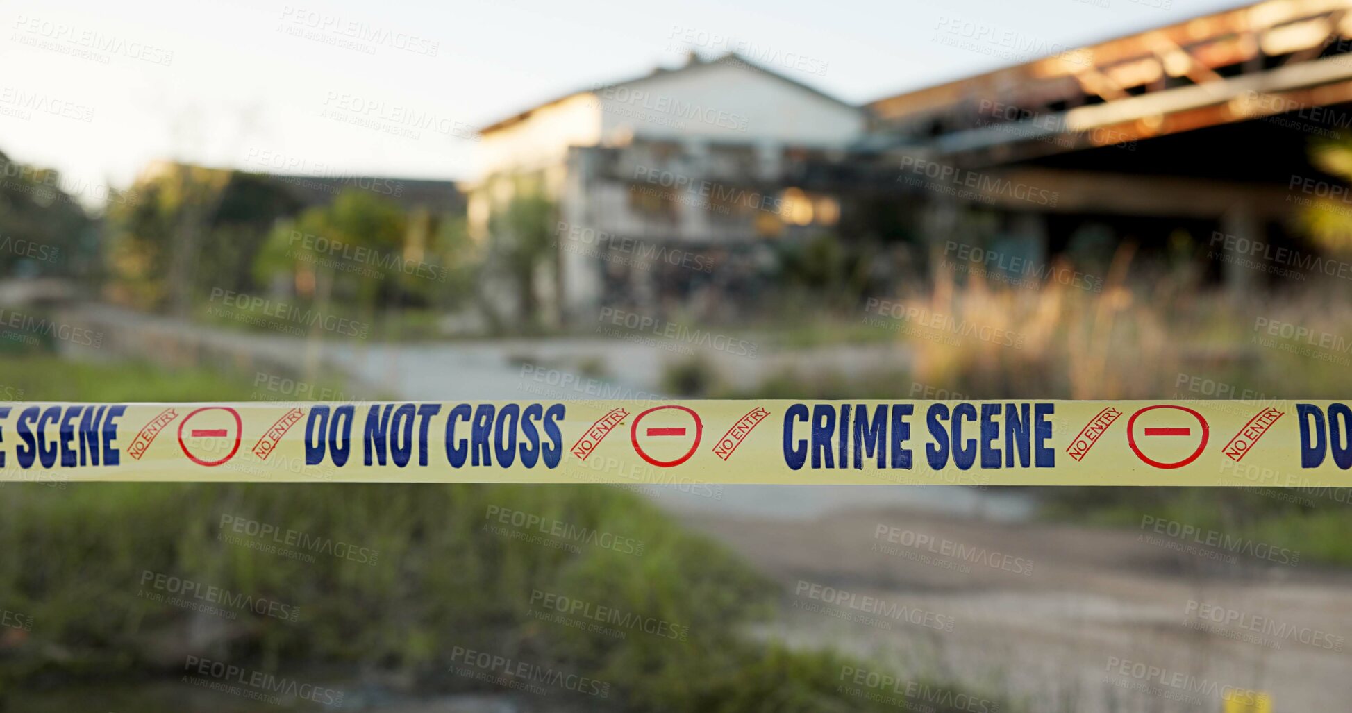 Buy stock photo Crime scene, police tape and caution outdoor for investigation with safety warning, danger or evidence. Forensic inspection, barrier sign and no entry in abandoned building for emergency and closeup