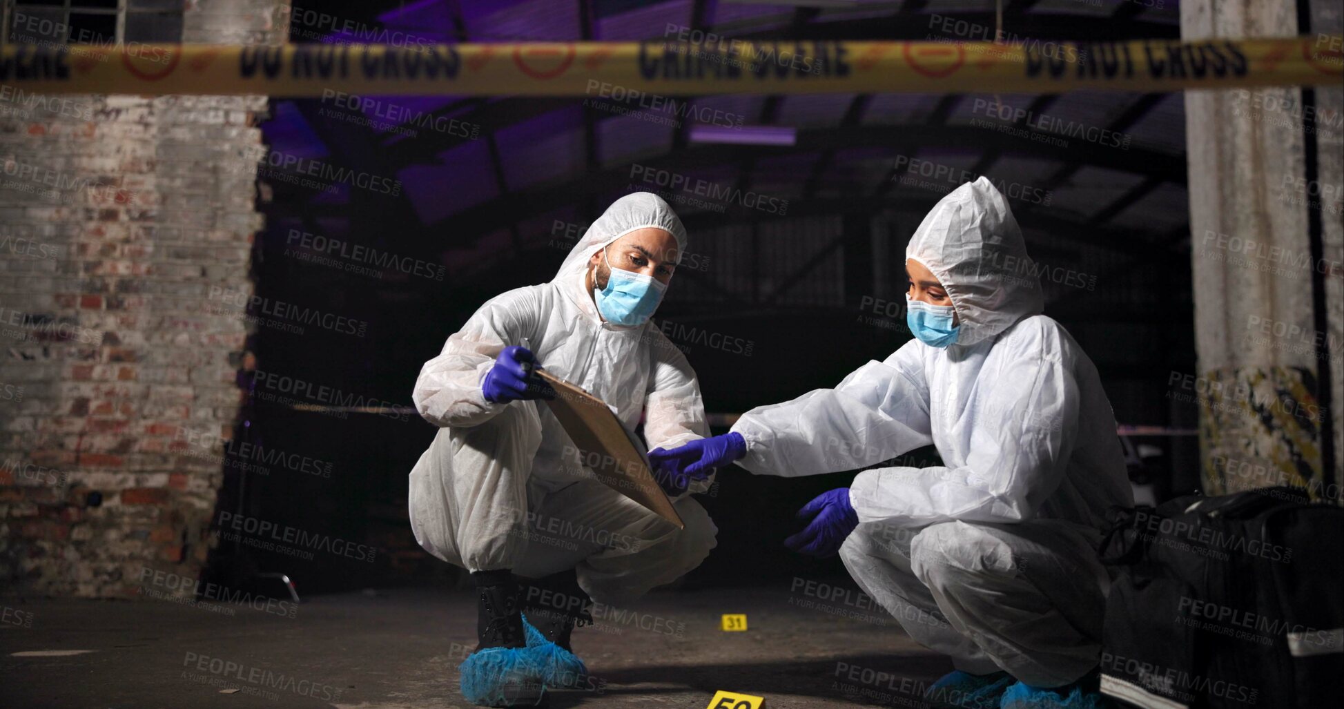 Buy stock photo Report, forensics team and crime scene investigation with clipboard, criminal analysis or evidence at night. Investigators, man and woman with police outdoor for discussion, planning or mystery clues