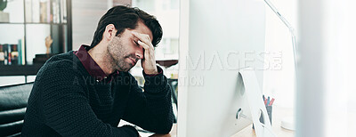 Buy stock photo Cropped shot of a young businessman looking dismayed by something on his computer