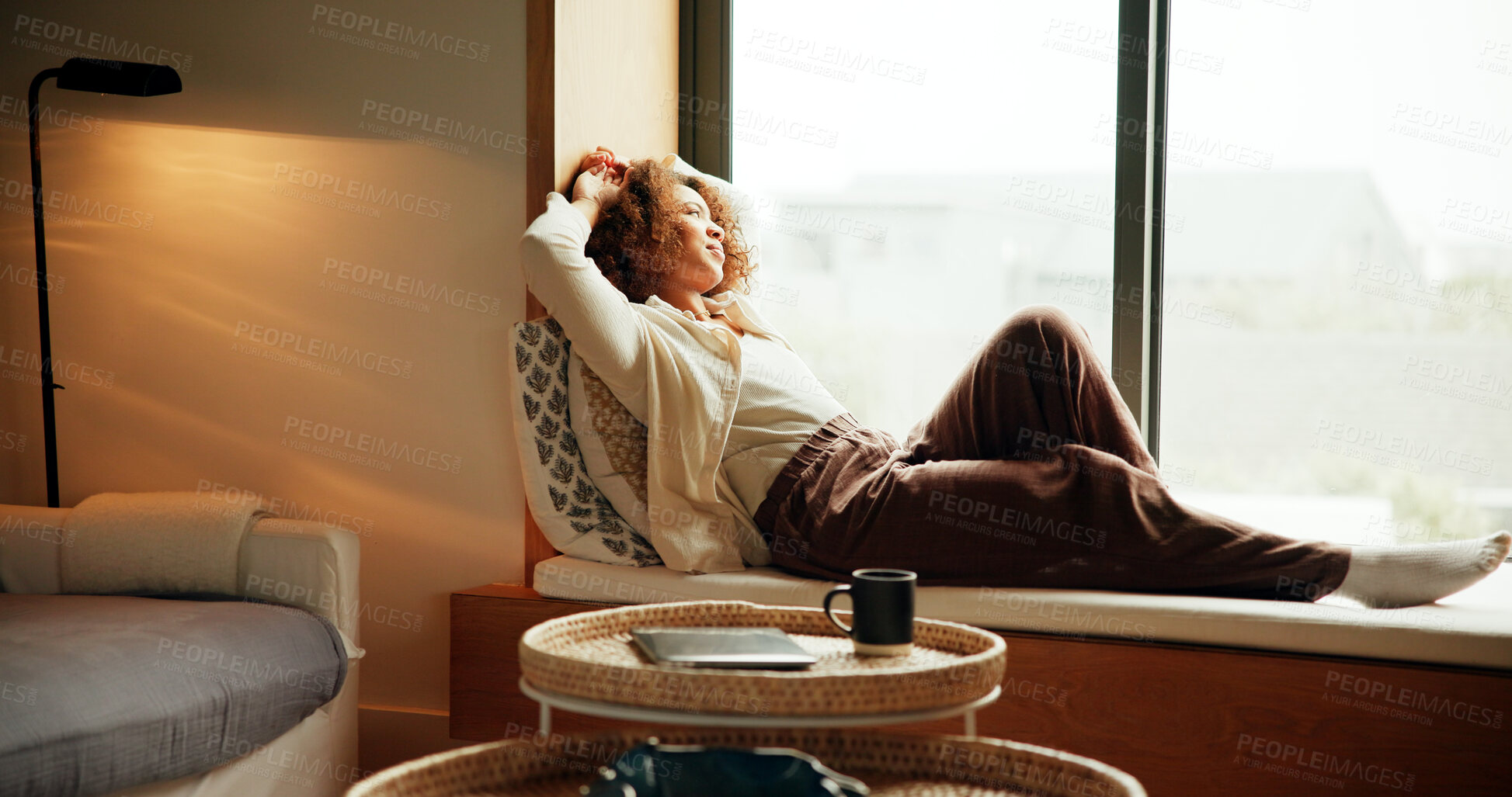 Buy stock photo Thinking, home and woman relax by window for view, calm and reflection of mindset in living room. Comfort, rest and African girl planning future decision, inspiration and vision with peace or dream