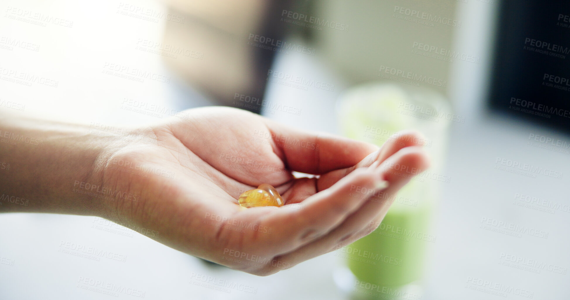 Buy stock photo Person, hands and diet pills in home for nutrition, detox and protein shake for weight loss. Green smoothie, vitamin drugs and closeup of supplements for wellness, healthy body or gut health in house