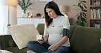 Blood pressure, monitor and health with pregnant woman on sofa for hypertension, medical and check. Pre eclampsia, maternity and pulse with person in living room at home for machine, checkup or heart