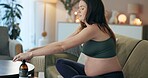 Product, skincare and stomach of pregnant woman on sofa for stretch marks, oil massage and dermatology. Health, body care and vitamin e with person in living room of home for cosmetic and moisturizer