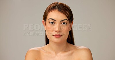 Buy stock photo Skincare, natural beauty and portrait of woman with glow, dermatology and serious on gray studio background. Face, confidence and model with makeup, cosmetics and spa facial treatment for aesthetic