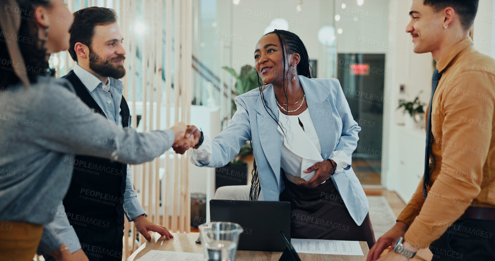 Buy stock photo Women, shaking hands and smile at meeting in office for welcome, excited and collaboration at media company. Business people, group and handshake with b2b agreement, deal or thanks at creative agency