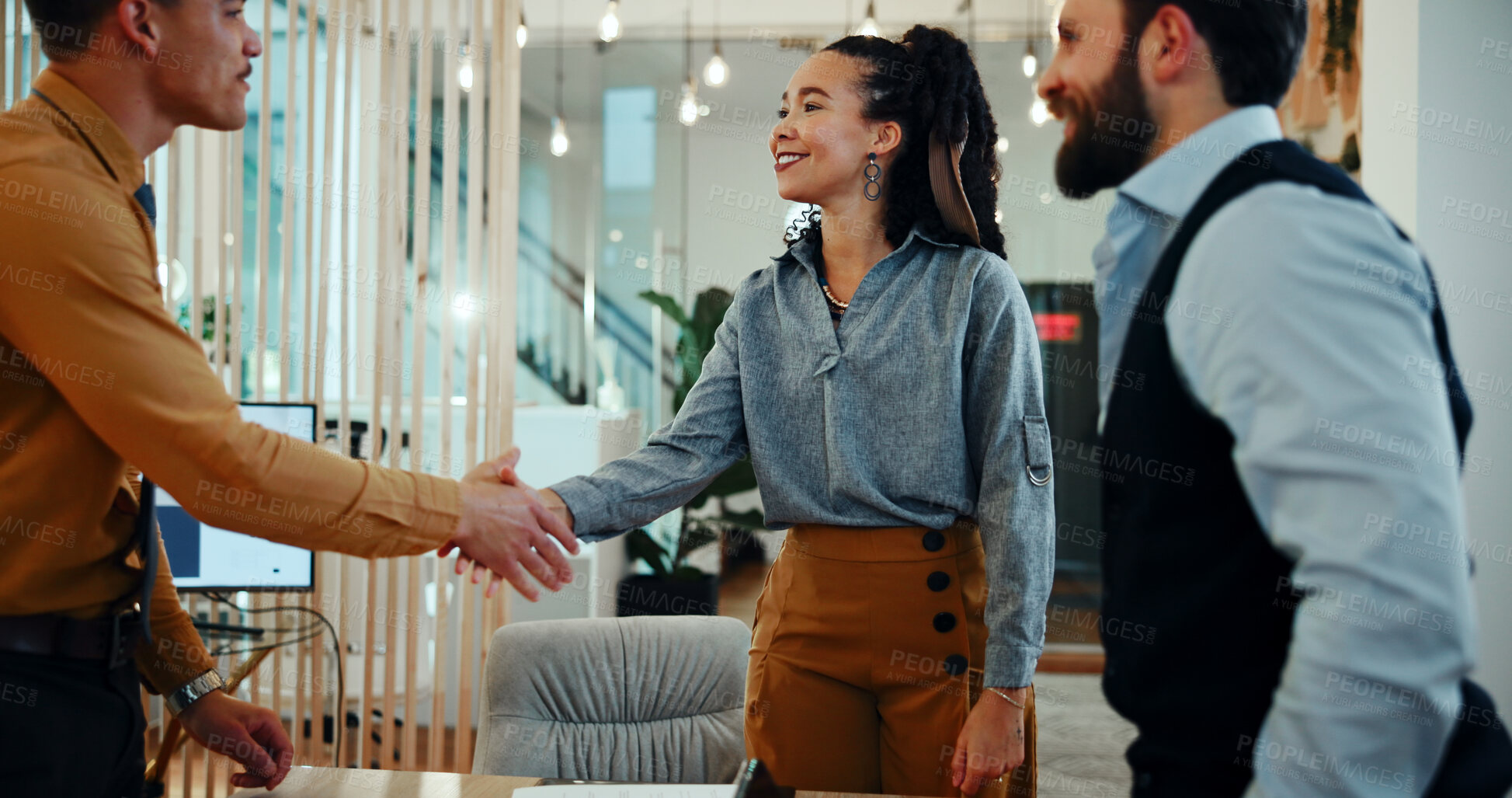 Buy stock photo Business man, woman and shaking hands in office with team for welcome, smile and deal at media company. People, group and handshake with b2b agreement, collaboration and happy at creative agency