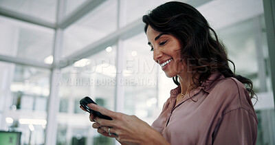 Buy stock photo Mature, business woman and smile with phone in office for communication, text message or positive feedback on email. Professional, person and happy with smartphone for notification, chat or good news