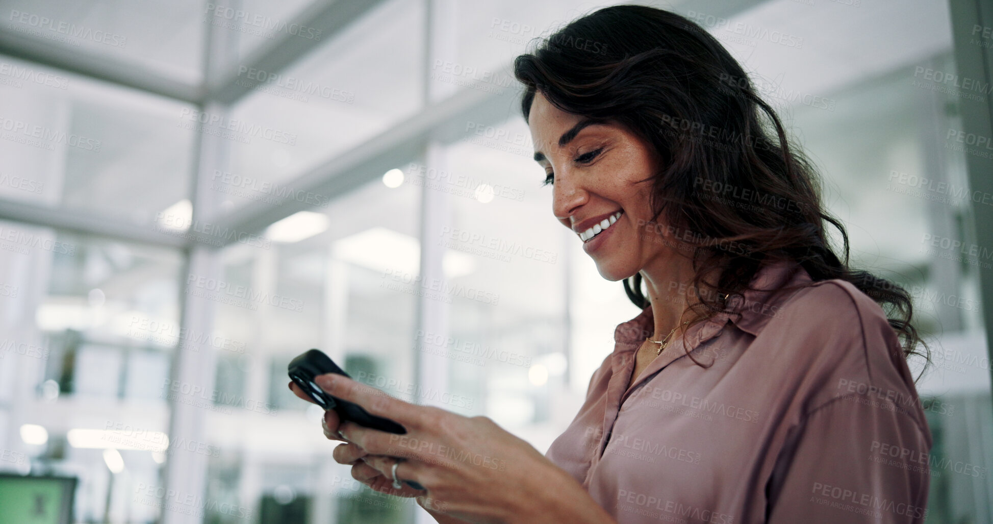 Buy stock photo Mature, business woman and smile with phone in office for communication, text message or positive feedback on email. Professional, person and happy with smartphone for notification, chat or good news