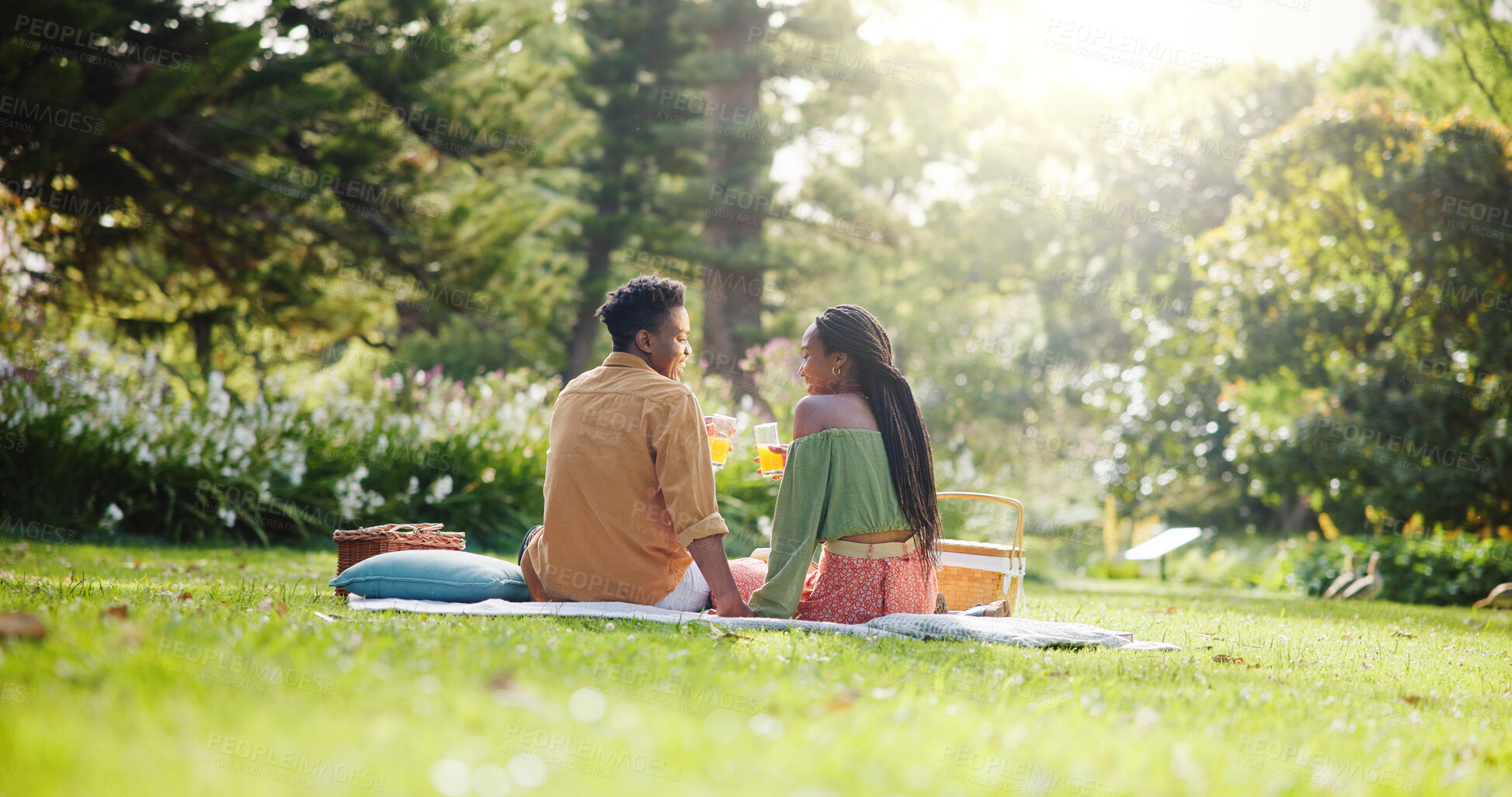 Buy stock photo Back, relax and love with black couple and picnic for bonding, happiness and romantic date. Calm, support and conversation with man and woman at park for commitment, valentines day and summer
