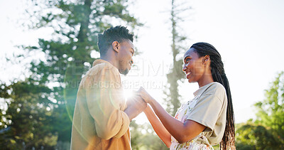 Buy stock photo Happy, love and black couple in park holding hands together for bonding, relationship and affection in nature. Relax, dating and man and woman outdoors for romance, holiday and commitment on weekend