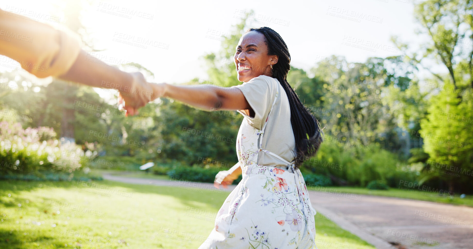 Buy stock photo Holding hands, spring and love with black couple in nature for romance, honeymoon date and bonding together. Celebration, happiness and smile with woman in park for relationship, support and care
