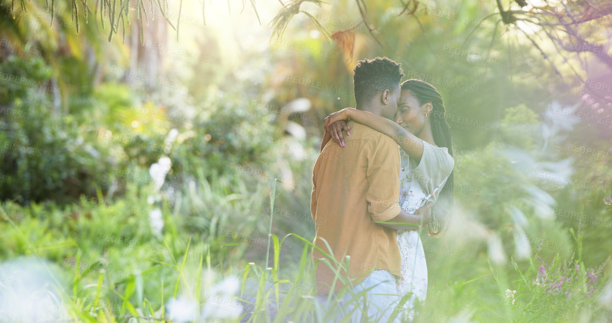 Buy stock photo Dance, date and love with black couple in nature for romance, honeymoon and bonding together. Celebration, happiness and flowers with man and woman in park for relationship, support and care
