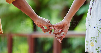Buy stock photo Holding hands, couple and outdoor with pinky promise for commitment, loyalty and trust together. Park, hope and people on vacation with partner on date with relationship, bonding and care with travel