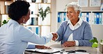 Consulting, handshake and healthcare with old woman and doctor for meeting, results or introduction. Medical, helping and discussion with people in clinic for treatment plan, checkup and patient exam