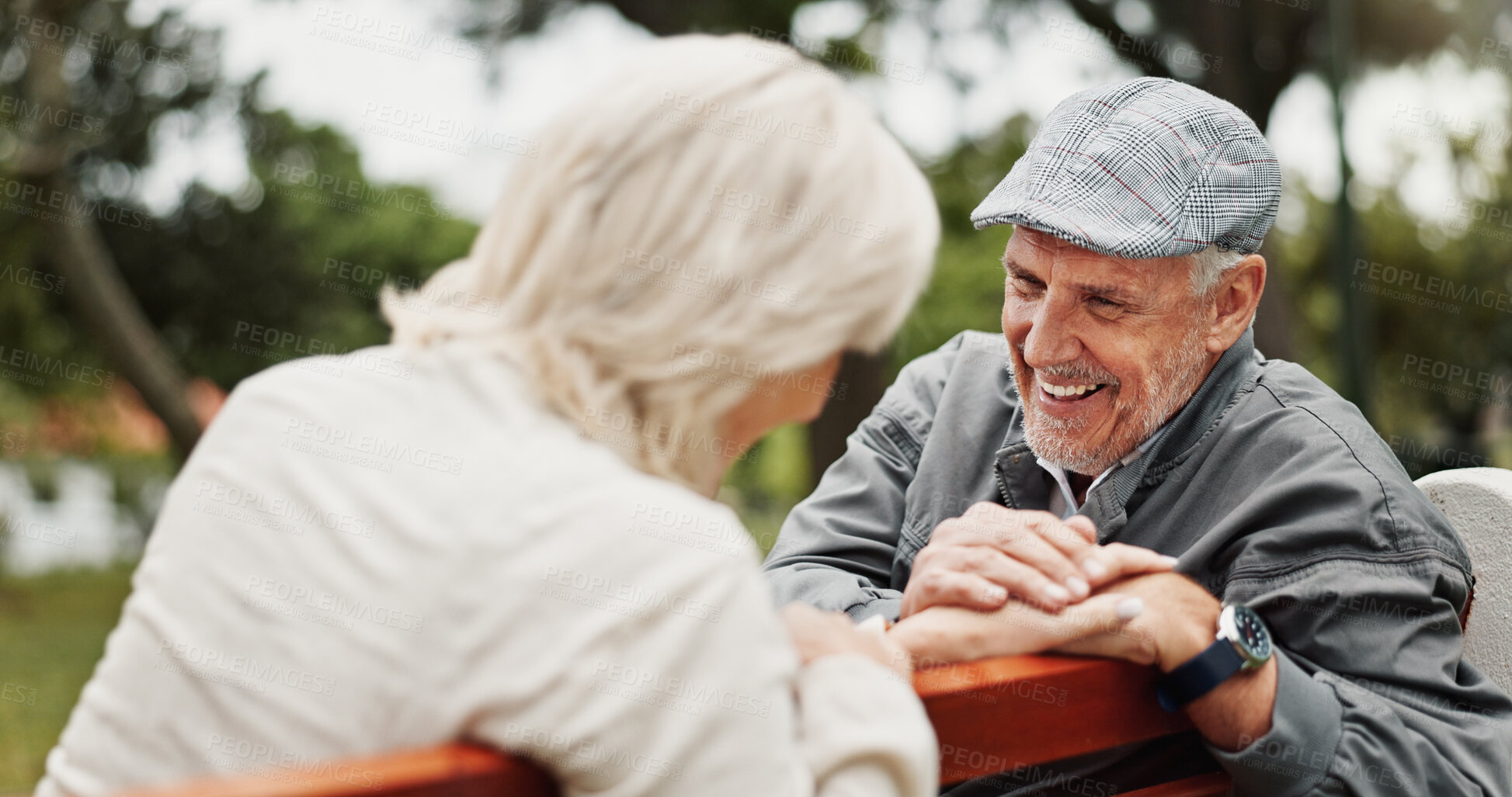 Buy stock photo Mature couple, laughing and smile in park for bonding, conversation and commitment together outdoors. Retirement, marriage and elderly man and women in nature on bench for love, care and connection