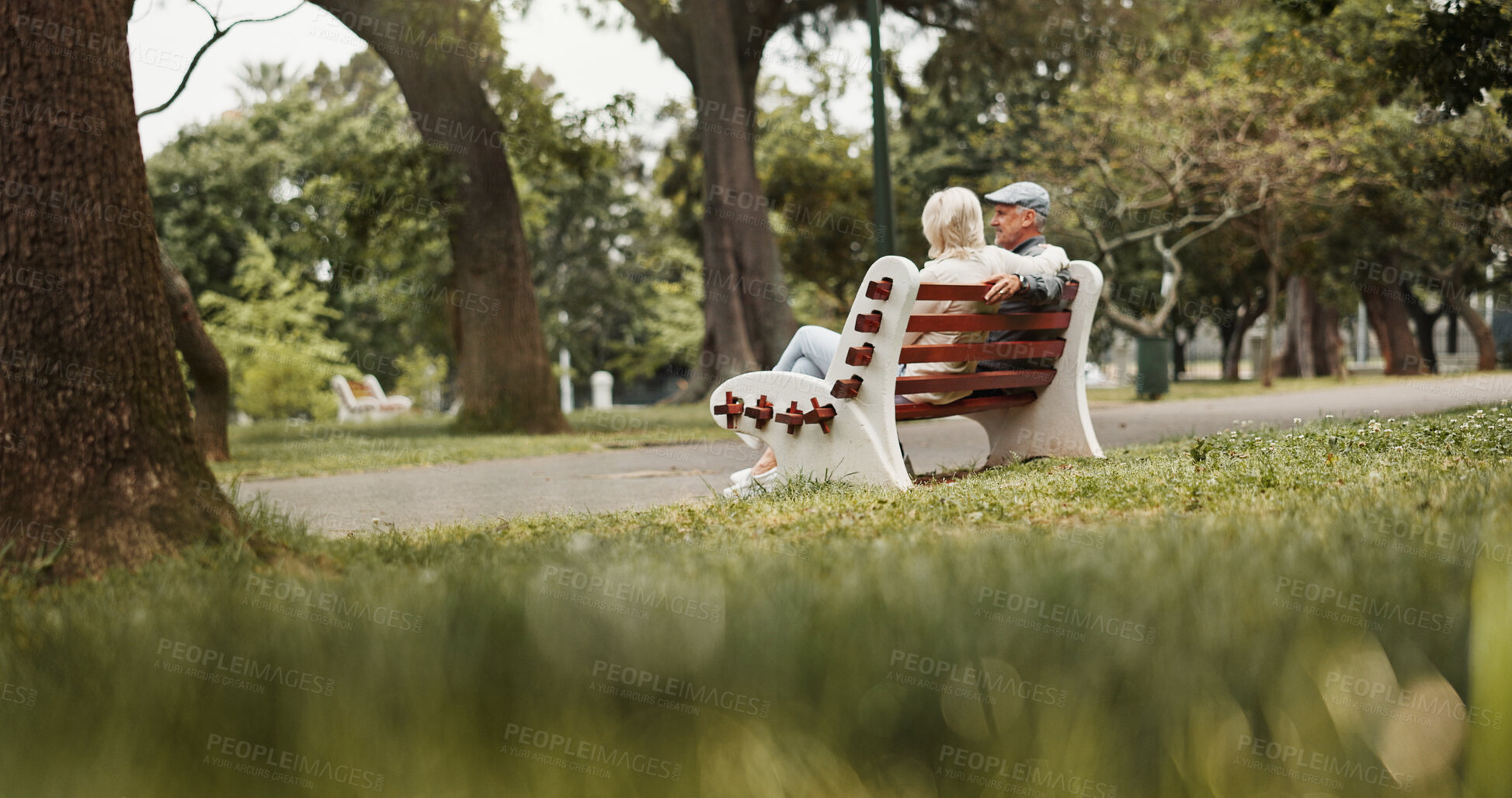 Buy stock photo Relax, love and bonding with old couple on park bench for retirement, happiness and wellness. Support, date and romance with senior man and woman in nature for partner, marriage and peace together