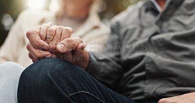 Buy stock photo Elderly couple, love and holding hands for bonding, support and marriage together outdoors. Retirement, empathy and Senior man with women pensioner on bench for care, compassion and connection