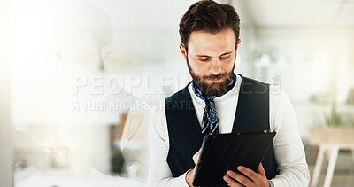 Buy stock photo Development, editing and tablet with business man in glass office as artistic publication designer. Creative, reading and technology with professional illustrator at work for online graphic design