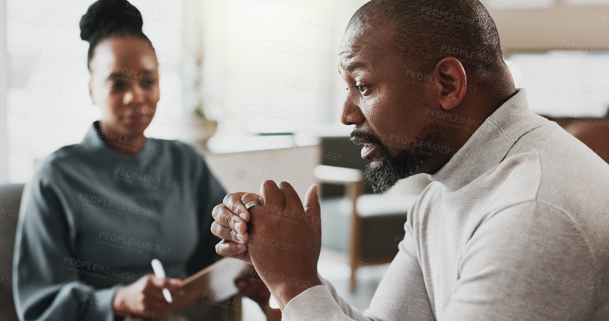 Buy stock photo Psychology, therapist and talking in office with patient, discussion and advice for mental health. Black people, therapy and notes in consultation for grief counseling, mistake and doubt in marriage