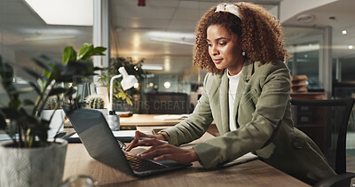 Buy stock photo Laptop, business woman and typing at night for report, magazine publication or deadline in startup office. Computer, writing and African worker with project, reading email or creative feedback online