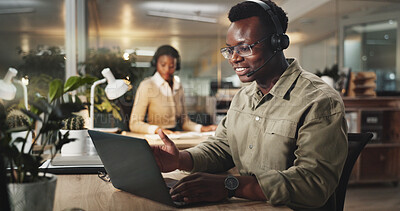 Buy stock photo Black man, night or consulting with laptop or headphones at call center for online advice or assistance. Male person, African consultant or agent with smile on computer for customer service at office