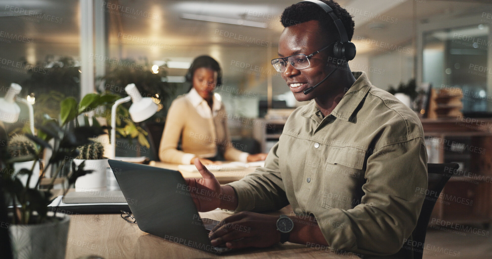 Buy stock photo Black man, night or consulting with laptop or headphones at call center for online advice or assistance. Male person, African consultant or agent with smile on computer for customer service at office