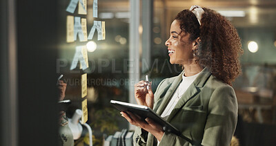 Buy stock photo Happy woman, tablet and thinking at glass for planning, deadline progress and sticky notes at night. Admin person, tech and smile in dark office for productivity, calendar schedule or ideas on window