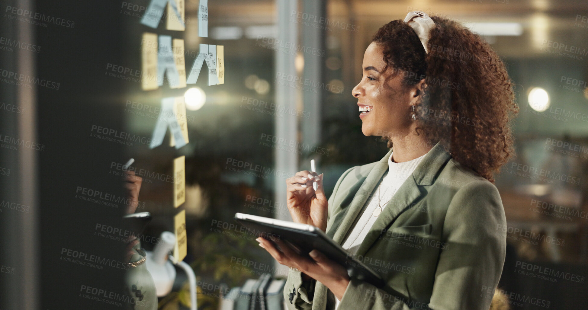 Buy stock photo Happy woman, tablet and thinking at glass for planning, deadline progress and sticky notes at night. Admin person, tech and smile in dark office for productivity, calendar schedule or ideas on window