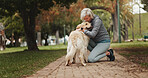 Love, dog walking and kiss with old woman in park for training, adventure and health. Animal care, support and morning with person and Labrador pet in nature for bonding, guide and wellness.