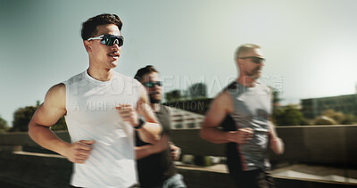 Buy stock photo Men, runner and group for exercise in city on bridge for training, challenge and motion blur in summer with speed. People, friends and fitness in urban street, fast and workout in morning in Germany