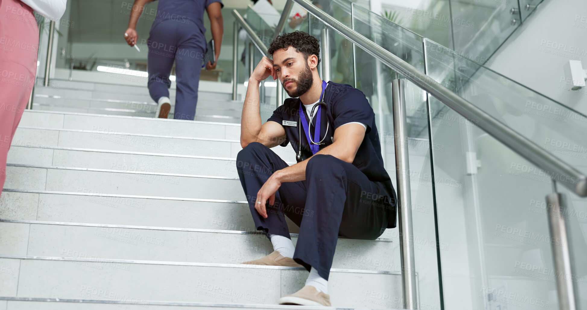 Buy stock photo Nurse, thinking and man with stress, depression and sad to regret patient loss on steps in hospital. Surgeon, professional and anxiety for medical fail, mental health challenge or mistake in clinic