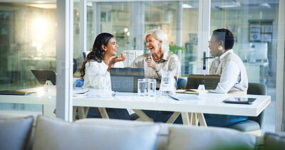 Buy stock photo Happy, business women and laughing with meeting for funny joke, conversation or social at office. Female people, employees or colleagues with smile for fun humor, comedy or team building at workplace