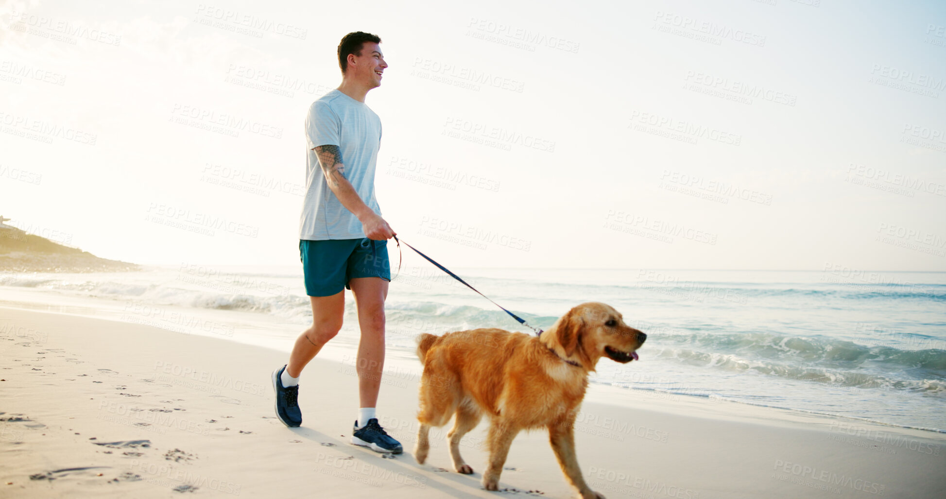 Buy stock photo Exercise, man and walking with dog at beach for fun adventure, wellness training and bonding with companion. Mockup, owner and pet on leash by ocean for cardio workout, fresh air and exploring nature