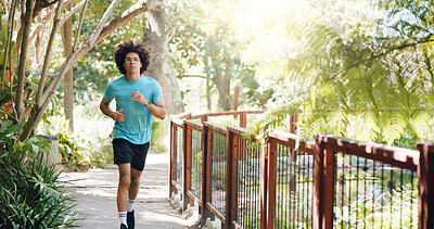 Buy stock photo Sports, nature and man running in park for health, wellness and body workout for marathon training. Fitness, activity and male athlete with cardio exercise on path outdoor in field for challenge.