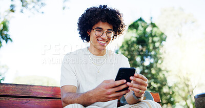 Buy stock photo Man, student and phone with smile on park bench, reading and break with mobile app in summer. Person, smartphone and happy in low angle with chat, contact and social network at campus in Costa Rica