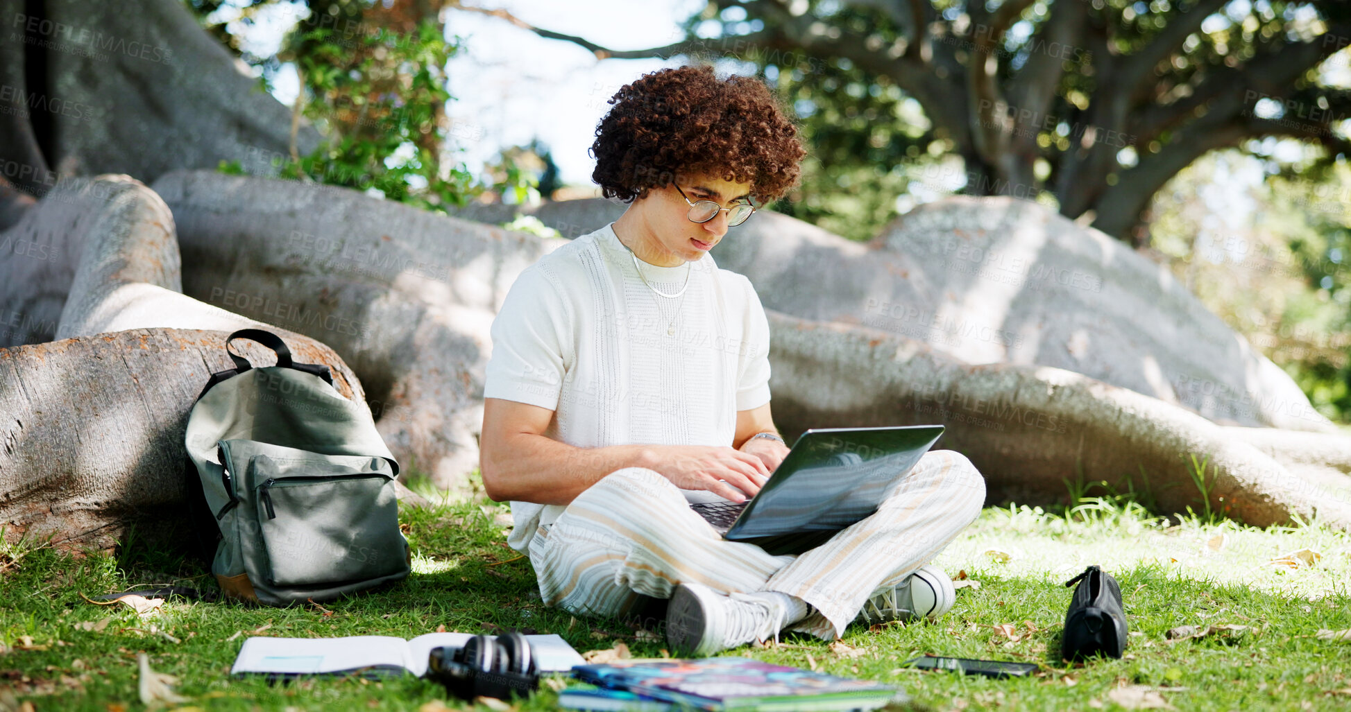 Buy stock photo Education, laptop and learning with man student outdoor on college or university campus to study. Computer, recess and typing with scholarship person at school for academic development or homework