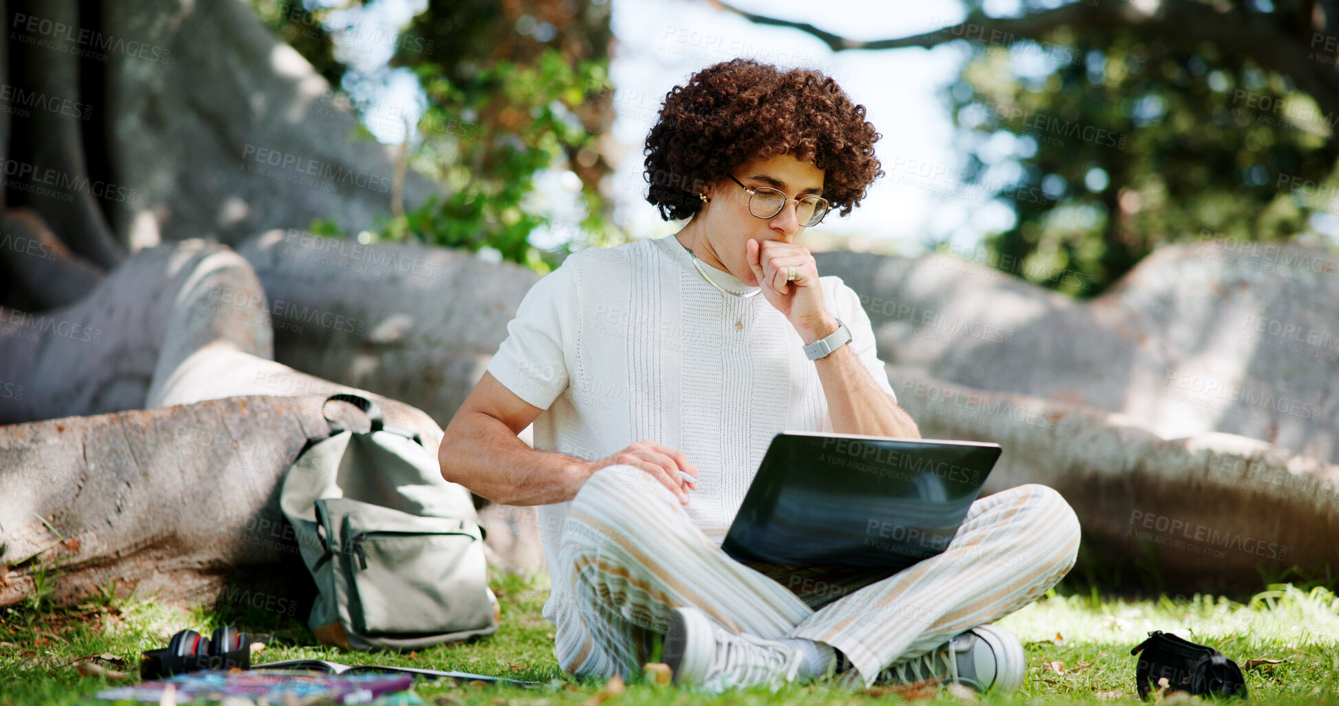 Buy stock photo Tired, student and laptop in park with fatigue, burnout and overwhelmed with study research. Exhausted, yawn and man outdoor with computer for university assessment, brain fog and project deadline