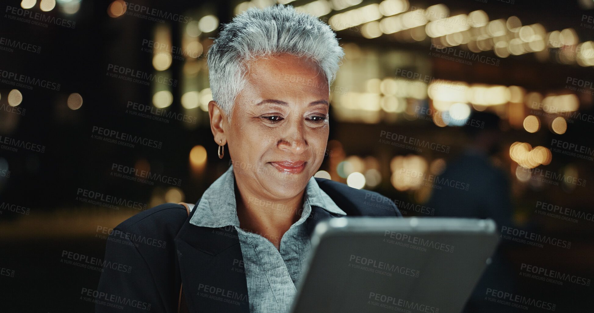 Buy stock photo Mature business woman, tablet and city at night, reading or contact on app with smile in street. Person, happy and digital touchscreen for notification, deal and email on urban sidewalk in Costa Rica