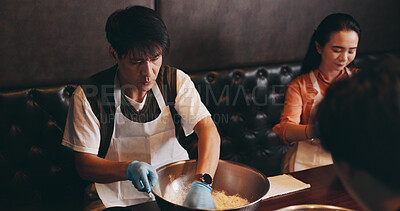 Buy stock photo Cooking, man and woman in class with chef, romantic date and bonding together at Asian food restaurant. Couple, learning and making noodles at cafe with teacher, culinary course and Japanese culture