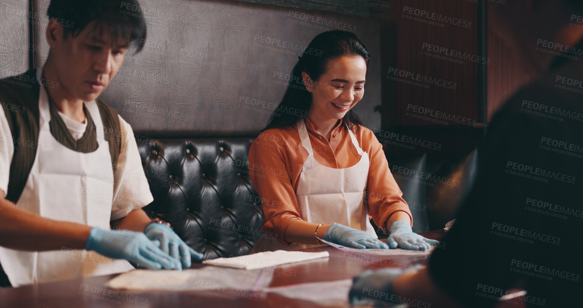 Buy stock photo Cooking, man and woman in class with recipe at restaurant for romantic date, bonding together and food. Couple, learning and noodles at cafe with smile, love and culinary course in Japanese culture