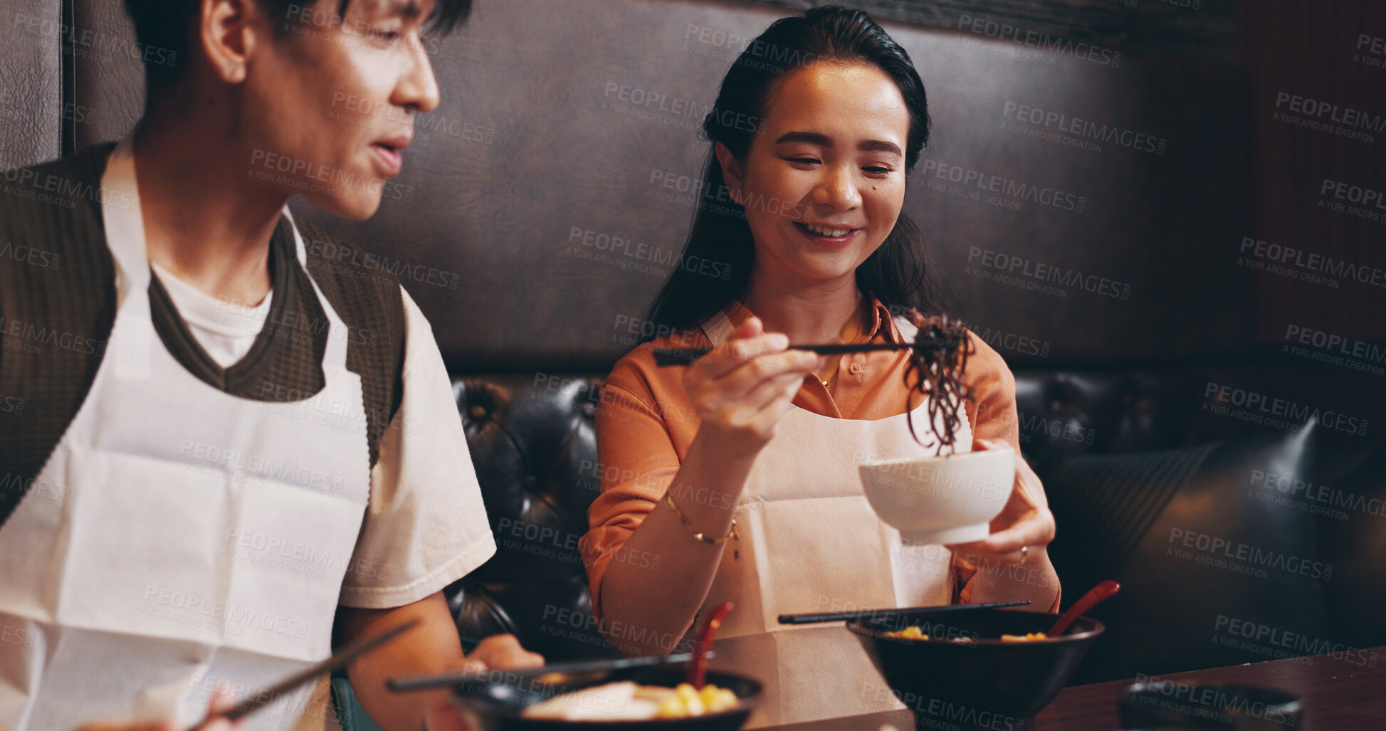 Buy stock photo Eating, ramen and Japanese couple at restaurant with food, vegetables and dinner with smile. Hungry, table and bowl with meal, asian cuisine and customer with chopsticks and health dish for nutrition