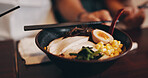 Asian restaurant, ramen and food with egg, meat and vegetables for dinner, lunch and supper. Culinary, traditional cuisine and closeup of bowl for healthy eating, nutrition and gourmet dish in Japan