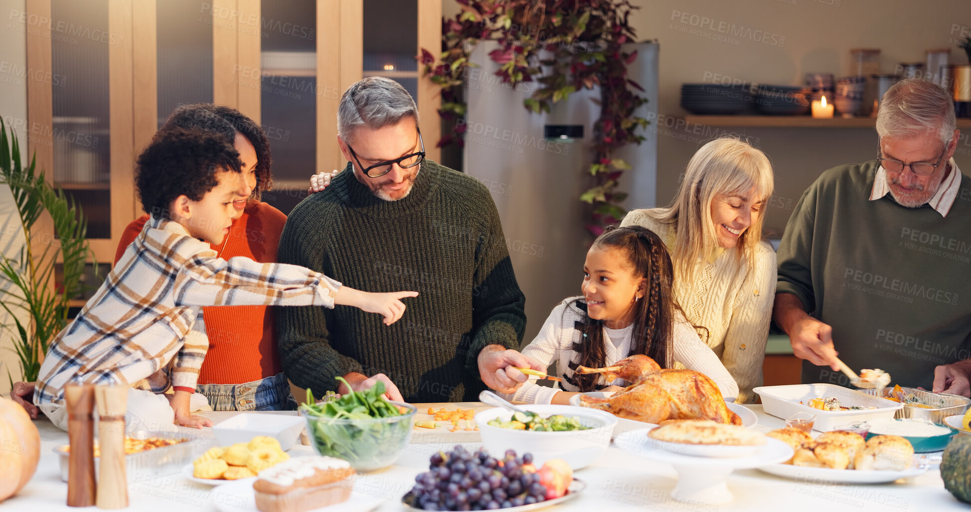 Buy stock photo Big family, celebration and thanksgiving dinner with kids, festive holiday and food for vacation. Feast, people and grandparents with love at party, table and nutrition for gathering, event and home
