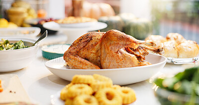 Buy stock photo Dinner, table and food with celebration for thanksgiving, nutrition and holiday for gratitude at home. Closeup, meal and dish for supper with turkey, vegetables and dessert for festive feast in house