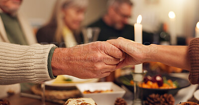 Buy stock photo Thanksgiving, people and holding hands with prayer for dinner, festive feast and holiday at home. Closeup, family and together with grace for spiritual connection, blessing and christian with meal