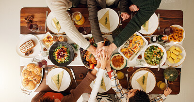 Buy stock photo Above, hands together and thanksgiving with family and food for celebration, support and festive holiday. Catering, gratitude and reunion with meal and people at home for dinner, hosting and health