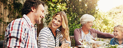 Buy stock photo Happy, lunch and parents with children in backyard for brunch, supper and eating together. Family, grandparents and mom, dad and kids with food for bonding at Thanksgiving, Christmas or festive party