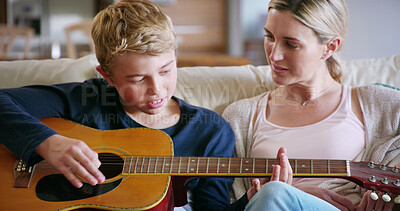 Buy stock photo Guitar, learning and child with mom, lesson and care in home with music, development and creativity. Living room, musician and knowledge with love, support and bonding together on couch with play